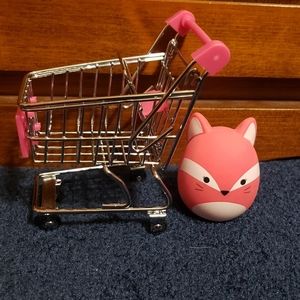 Squishmallow Squooshems fox stress ball toy in mini shopping cart.